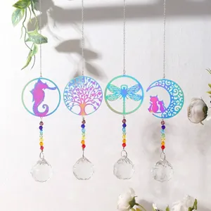 Detailed view of four colorful metal suncatchers featuring crystal prism ball pendants.