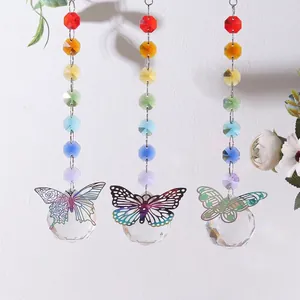 Macro view of rainbow crystal sun catchers featuring delicate metallic butterfly charms.