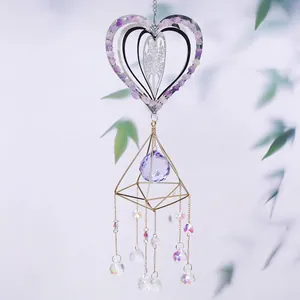 Heart-shaped crystal suncatcher with purple stones and geometric pendant detail