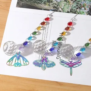 Detail showing faceted crystal balls with rainbow beads and iridescent insect charms