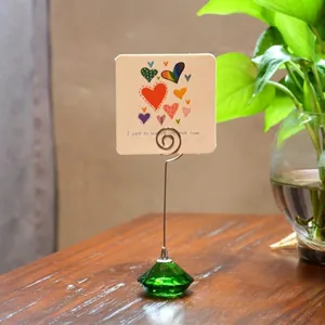 Heart patterned memo holder featuring a green crystal diamond base and silver metal spiral clip