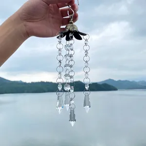 Close-up of an antique bronze crystal suncatcher wind chime pendant for garden decor