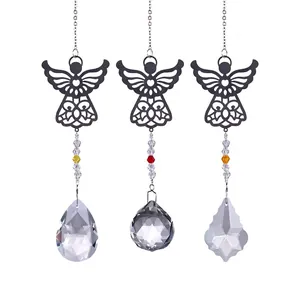 Detailed view of three metal angel crystal suncatcher pendants with varied prism shapes
