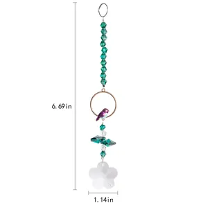 Detailed view of the crystal bird ornament showing dimensions of 6.69 and 1.14 inches