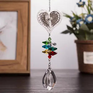 Hanging heart-shaped metal suncatcher with colorful crystal beads and teardrop prism