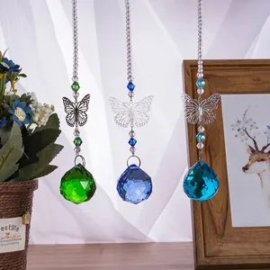 Set of three crystal butterfly suncatchers in green, dark blue, and cyan colors.