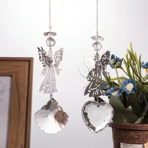 Detailed view of metal angel suncatchers featuring heart and scallop crystal prisms.