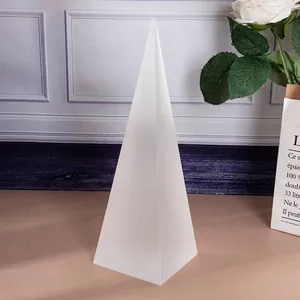 Close-up detail of a white frosted geometric pyramid glass ornament for Nordic home decor