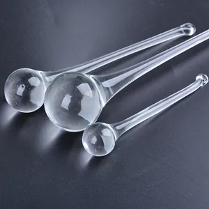 Detailed macro view of three clear glass water drop pendants for wedding and lighting decor