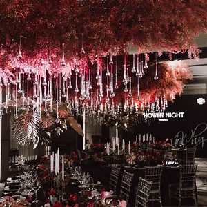 Detailed view of luxury glass water drop pendants hanging in a grand wedding venue