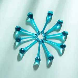 Macro view of crystal blue waterdrop pendants arranged in a circular floral pattern.