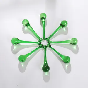 Detailed view of emerald green glass teardrop pendants for chandeliers and wedding decor