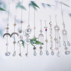Collection of silver crystal suncatchers with moon and sun motifs for garden decor