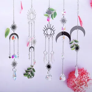 Detailed display of silver celestial suncatchers featuring moon eye and crystal prisms