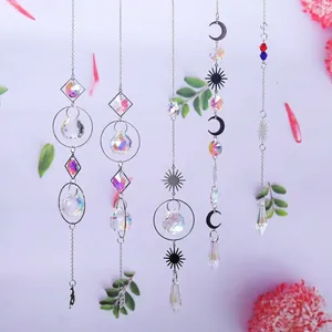 Detailed display of various silver crystal suncatchers featuring moon and star motifs for gardens