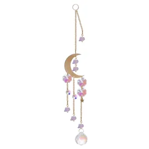 Detailed view of purple raw stone and crescent moon iridescent crystal suncatcher