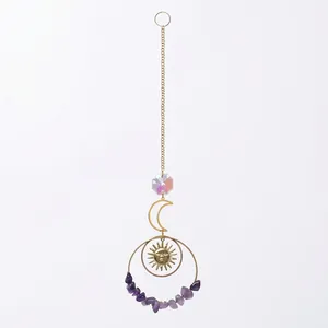Purple crystal suncatcher hanging ornament featuring sun and moon gold metal design elements