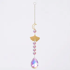 Detail view of the AB color crystal suncatcher featuring golden moon and ginkgo leaf
