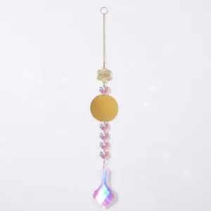 Detail view of an iridescent crystal prism suncatcher with elegant gold floral elements