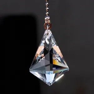 Macro detail showing a clear faceted crystal pendant for ceiling fan or light pulls.