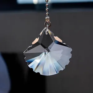 Macro detail of a multi-faceted crystal shell pendant for decorative ceiling fan pull chains