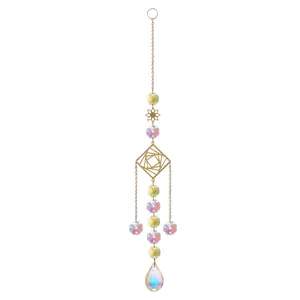 Detailed view of a golden suncatcher with iridescent crystals and geometric designs