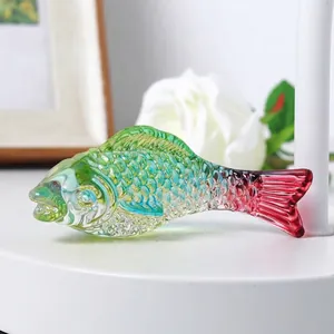 Macro detail of a colorful glass fish figurine showing intricate scale textures.