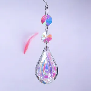 Close-up detail of a sparkling teardrop crystal prism with vibrant AB rainbow coating