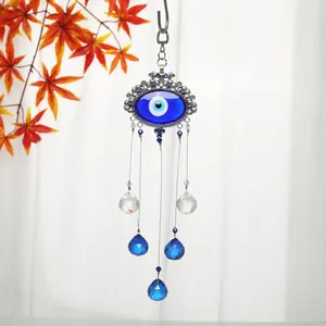 Detailed view of Turkish Evil Eye ornament with sparkling blue crystal teardrops