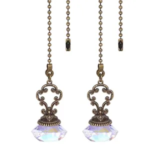 Detailed view of antique bronze ceiling fan pull chain with AB iridescent diamond crystal.
