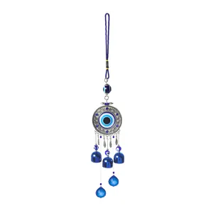Detailed close-up view of a Turkish Evil Eye hanging wind chime with blue bells and crystals