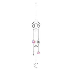 Detailed view of silver suncatcher featuring celestial eye moon star and prism crystals
