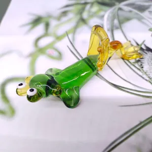 Detailed view of a green glass frog figurine in a lying pose for home decor