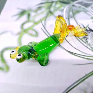 Detailed view of a green glass frog figurine in a reclining pose for home decoration