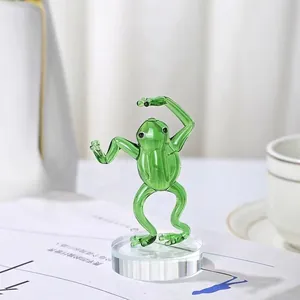 Detailed handcrafted green glass frog figurine in yoga pose standing on crystal base