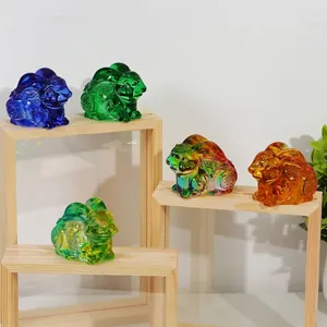 Detailed view of five colorful crystal zodiac rabbit figurines on minimalist wooden stands