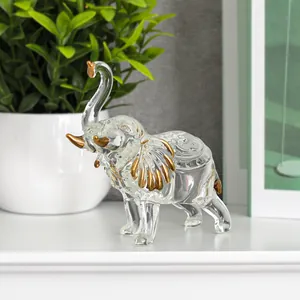 Detailed view of a light luxury glass elephant figurine with gold accents on ears