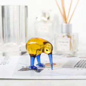 Macro detail of amber and blue hand-blown glass kiwi bird figurine for home decoration