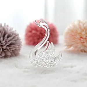Detailed macro view of an elegant transparent crystal swan figurine for home decor