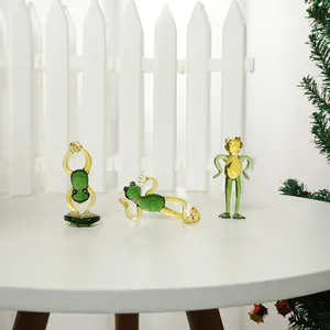 Set of three miniature green glass frog figurines in different yoga poses for home decor