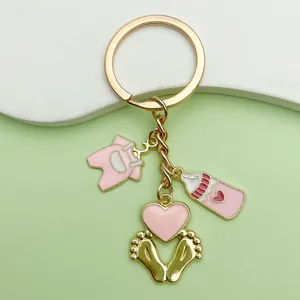 Cute pink baby shower keychain with milk bottle and outfit charms for newborn gifts
