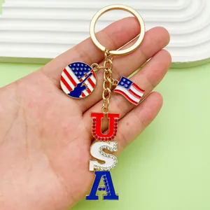 Close-up of patriotic USA keychain featuring flag and Statue of Liberty charms for gift.