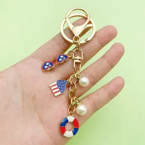 Detailed view of USA theme keychain with stars, stripes charms and elegant white pearls.
