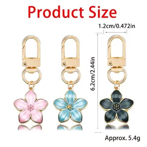 Three-piece enamel cherry blossom flower keychains in pink blue black with size measurements