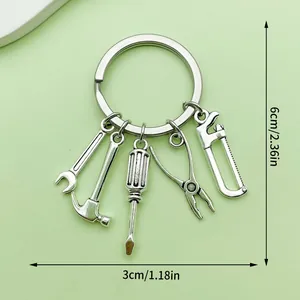 Silver-colored metal keychain featuring various tool charms and explicit dimension markings