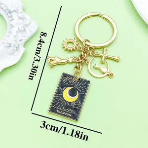 Detailed view of black alloy moon tarot card keychain with sun and cross charms and dimensions