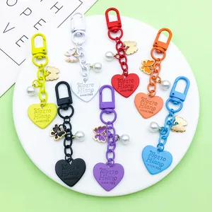 Colorful heart butterfly pearl keychains in multiple vibrant colors shown together