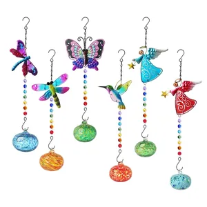 Detail of colorful hummingbird and butterfly suncatchers with glass globes