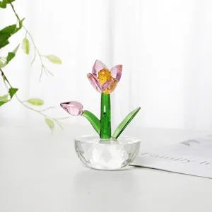 Detailed close-up shot of an elegant pink crystal tulip figurine with a faceted diamond base