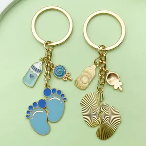 Detail view showing the front and back of blue baby footprints milk bottle keychains